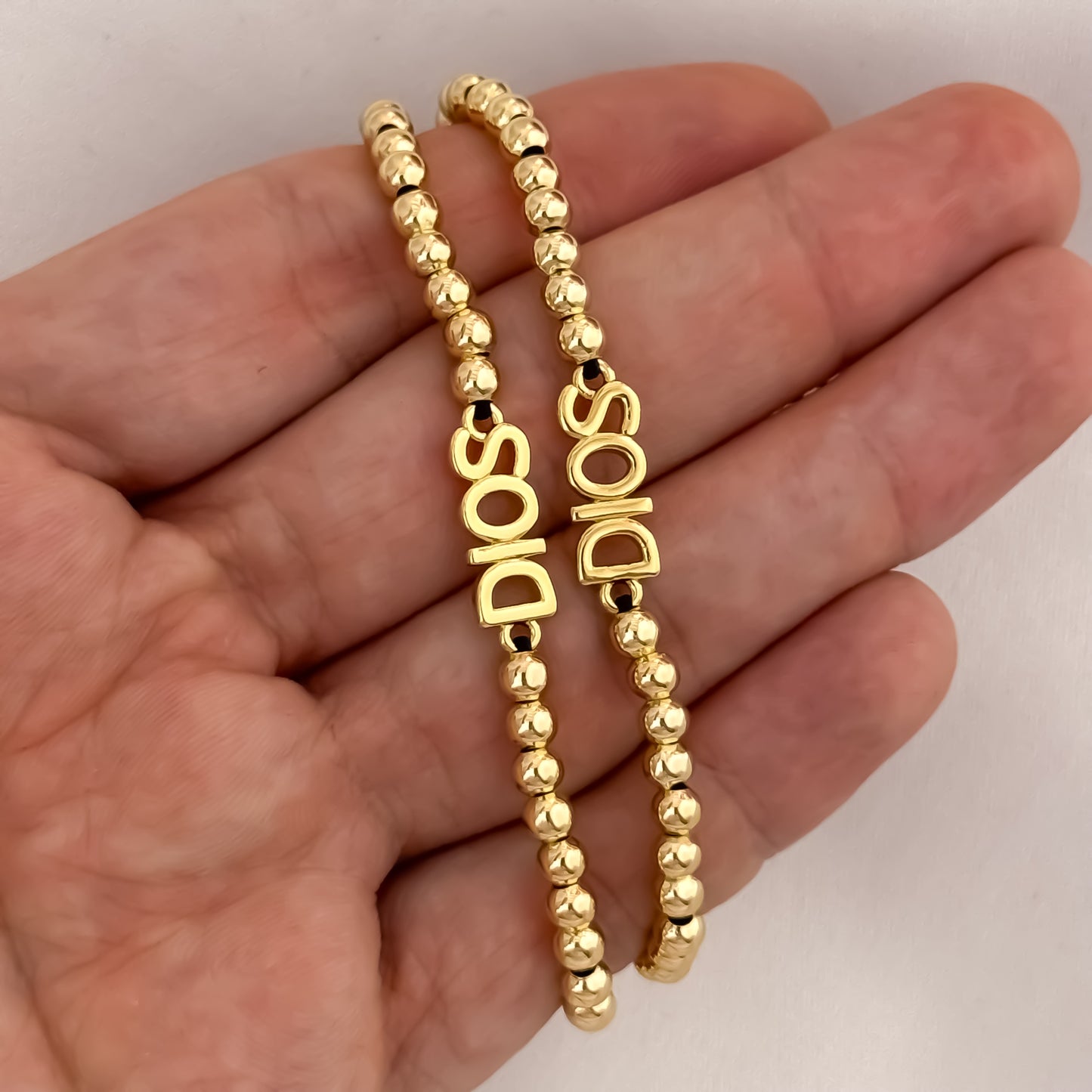 Promoción de 2 Pulseras para Parejas en Balin Liso de 4mm con Herrajes de Dios en Oro Laminado 18k con Garantia de por vida